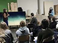 Christina Stadlbauer talking to an audience in front of screen